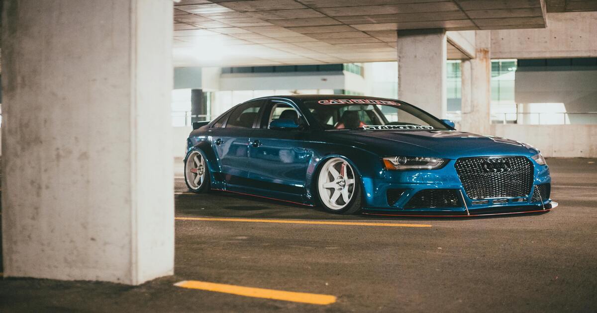 A modified Audi S4 in a parking lot.