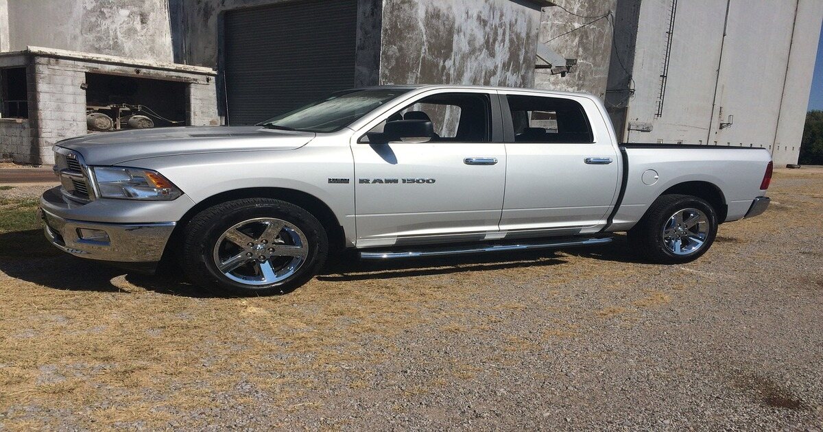 An image of a parked silver Dodge RAM 1500.