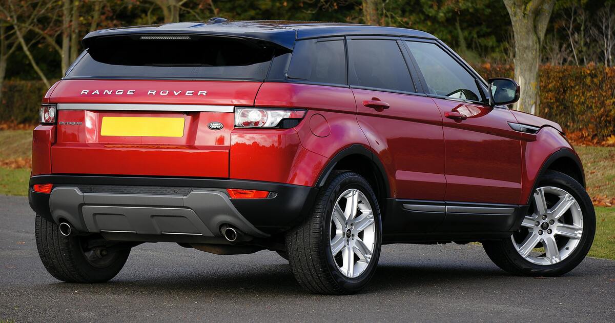 An image of the back of a red 4x4 Range Rover. 