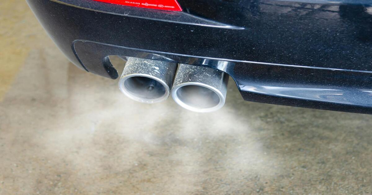 A close-up image of a black 4x4's exhaust system.